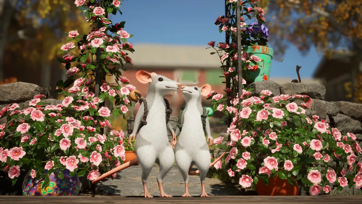 Two mouse familiars standing among pink flowers