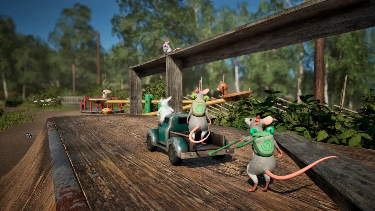 Two mice and a toy truck on a wooden porch