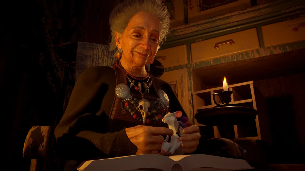 The witch holding a small mouse by candlelight